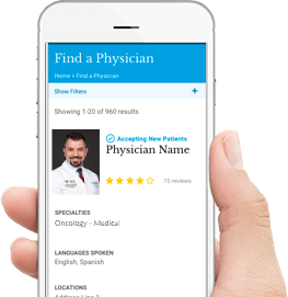 Hand holding phone displaying Karmanos doctor profile